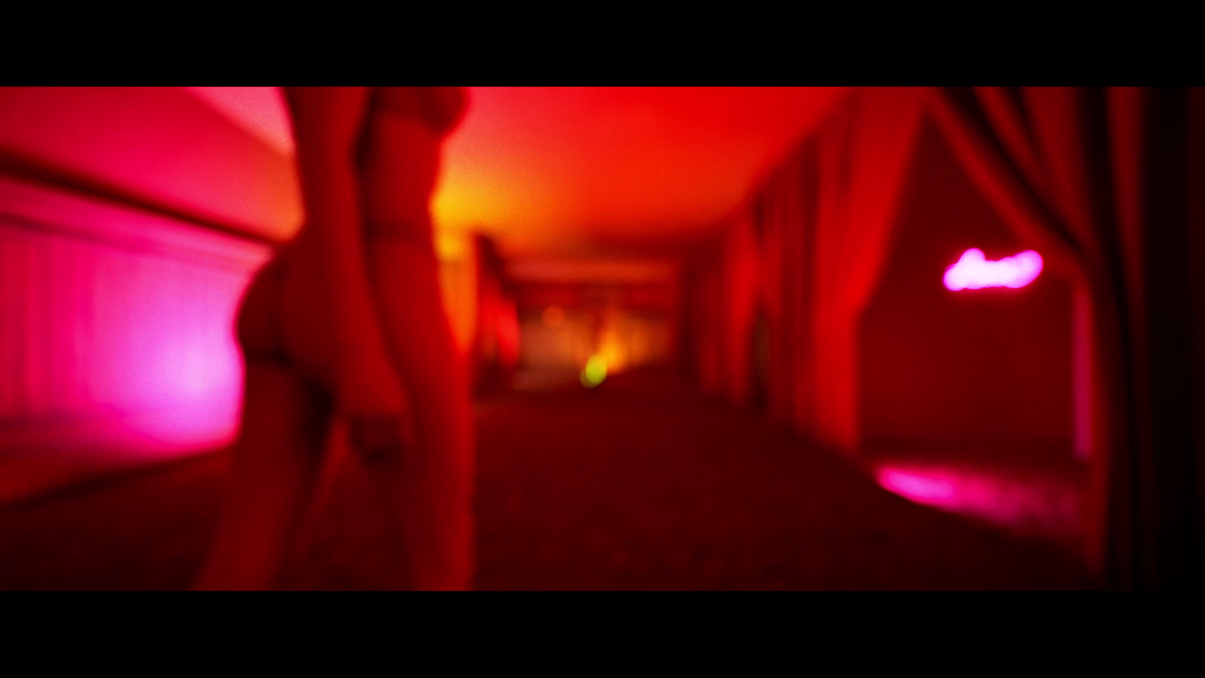 Red and magenta light in the Pisces Rising visual development.