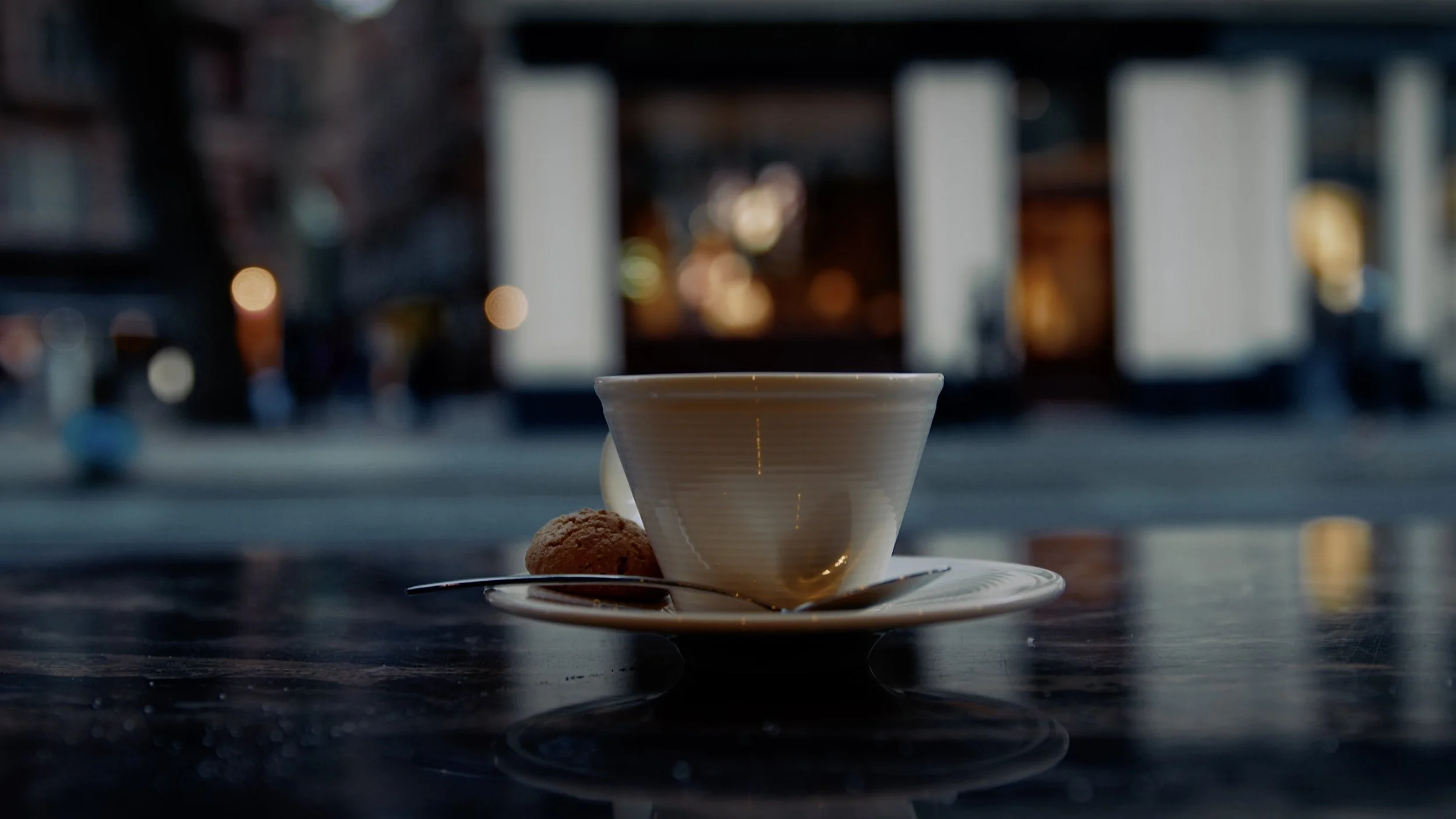 A softly focused London street at night, from Ryan Chang's History Repeating reel.